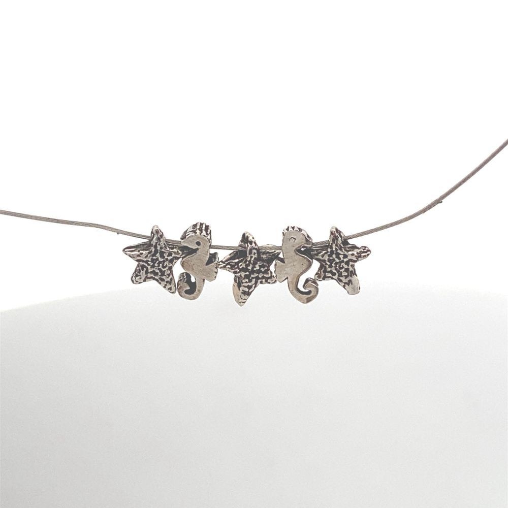 
                      
                        Starfish and Seahorse Necklace
                      
                    